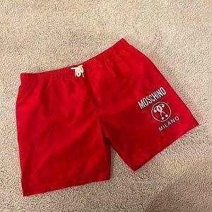 Moschino boys swimming shorts in red. Size 10. 100% authentic